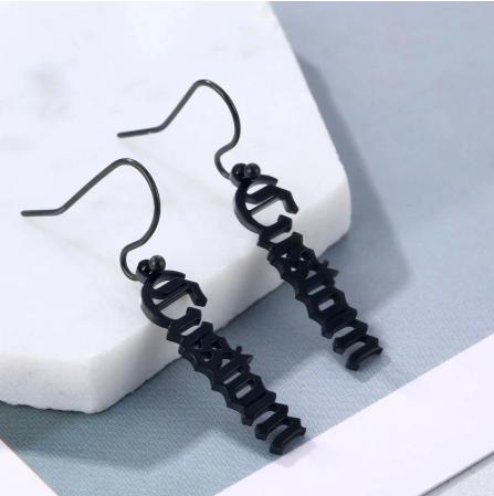Close up photo of Black gun plated drop earrings from custom name jewelry